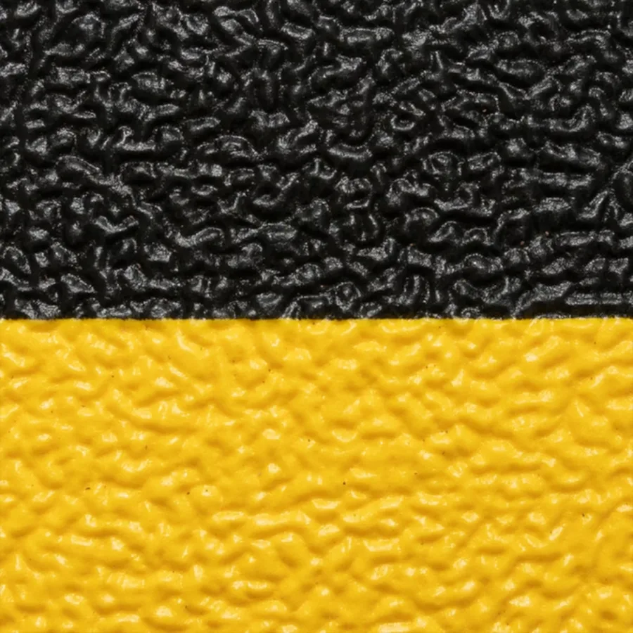 Alfombra antifatiga Sof-Tred negra con bordes biselados amarillos, de 122cm x metro — Detalle del producto